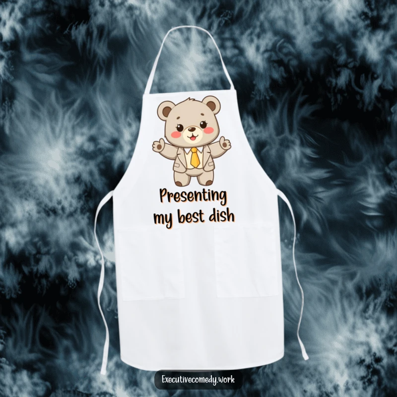 Funny bear cub wearing a tiny suit and tie, enthusiastically presenting its culinary skills on a practical kitchen apron.
